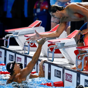 Manuel Frigo, Thomas Ceccon of Italy celebrate after winning the silver medal in the swimming 4x100m Freestyle Relay Men Final during the 22nd World Aquatics Championships at the WAC Arena in Singapore (Singapore), July 27, 2025.